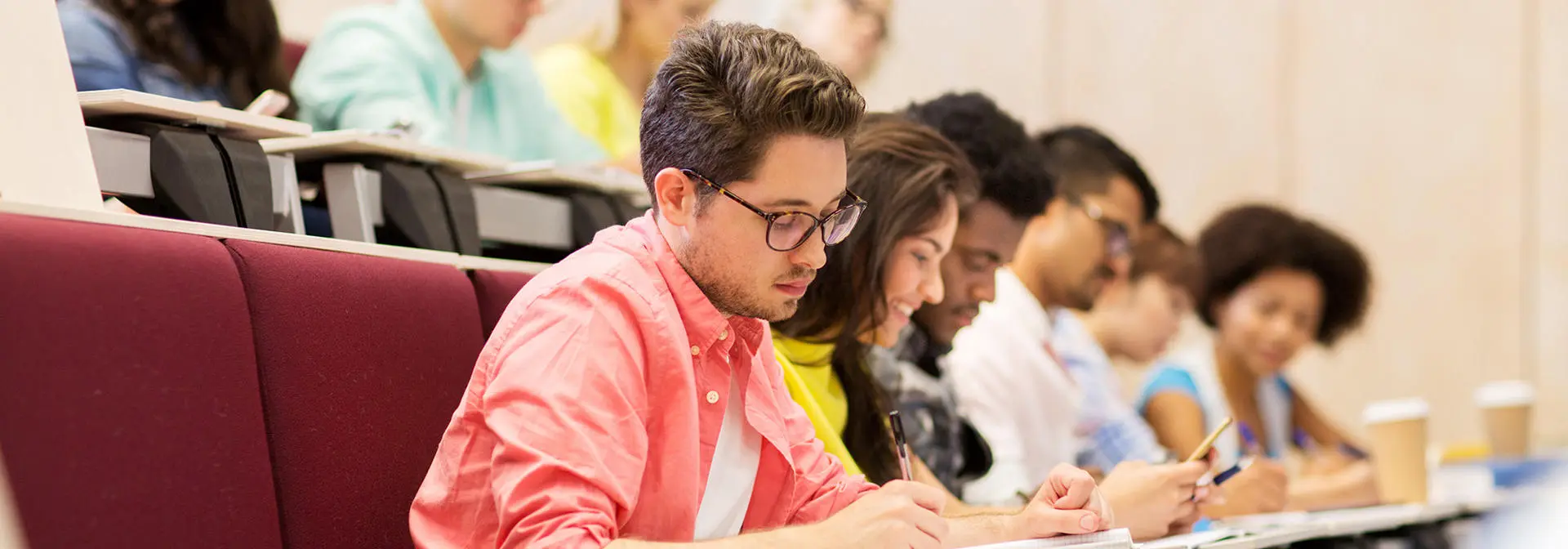 Students in a lecture taking notes