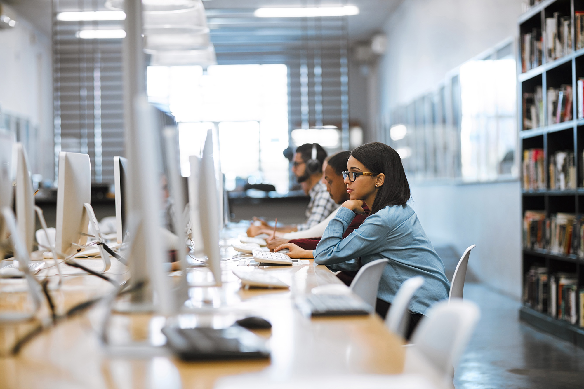 A student working in the library on a computer