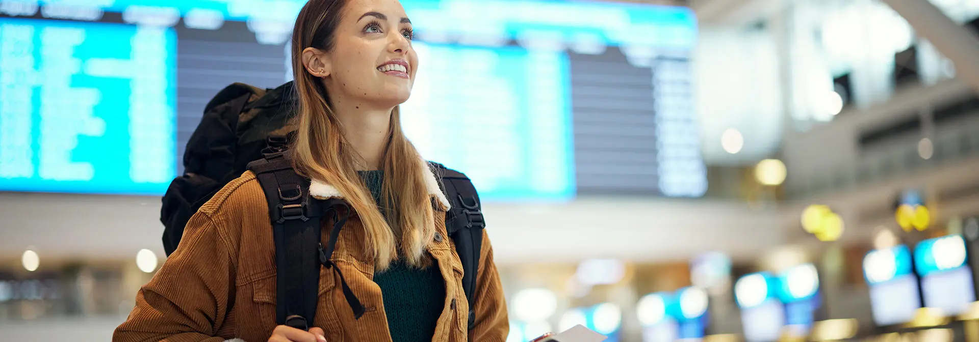 Student backpacking through an airport.