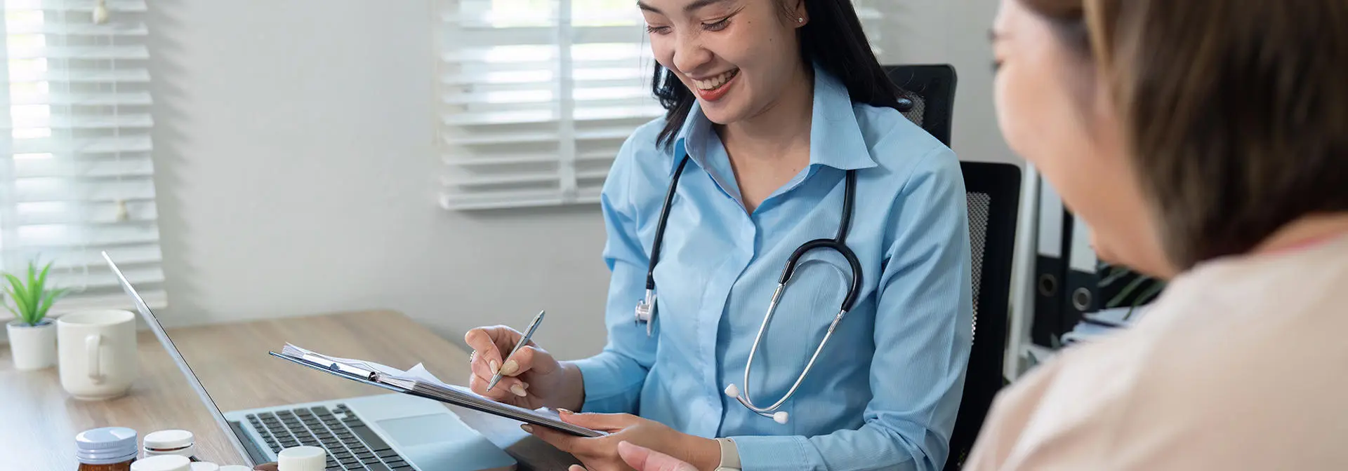 Doctor takes a patient's blood pressure.