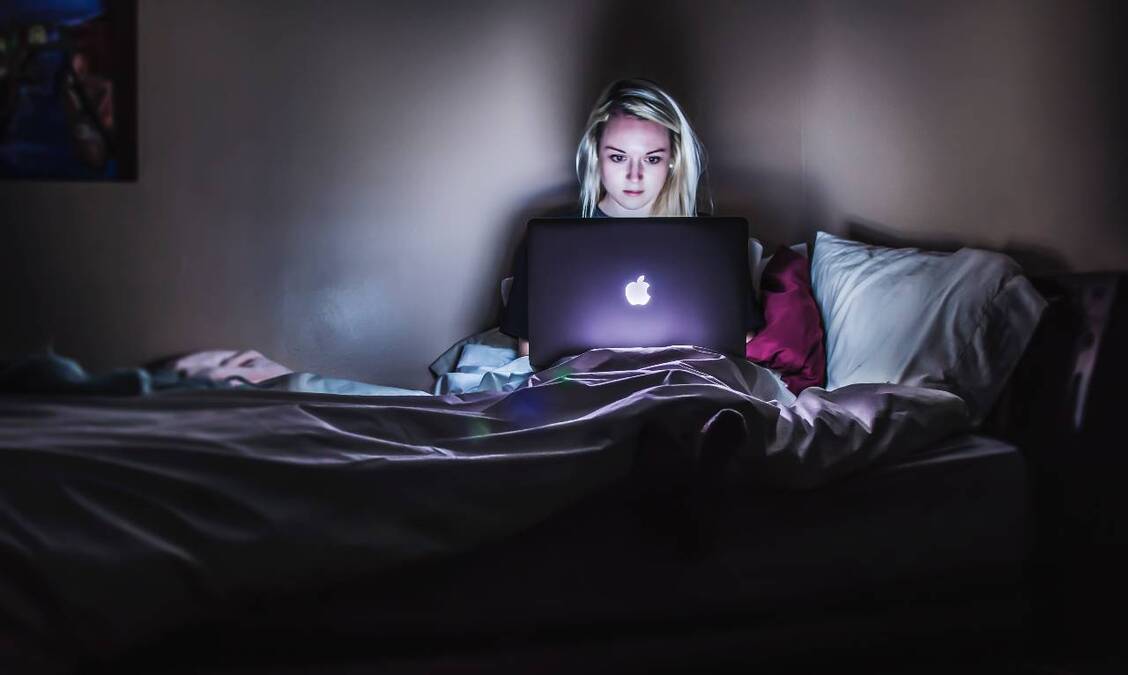 Concerned woman looking at laptop