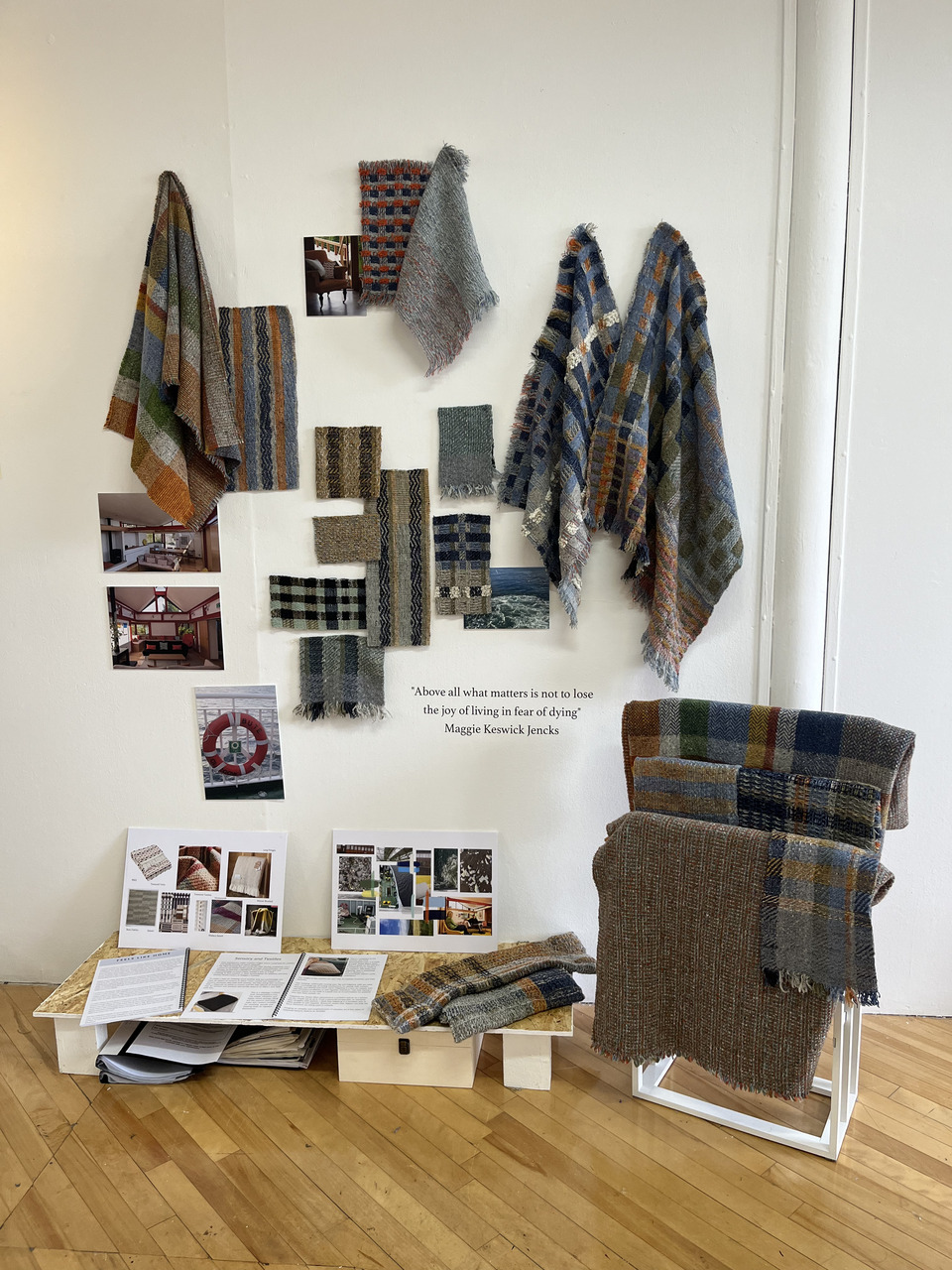 display showcasing a unique collection of textile swatches, scarfs, throws and blankets