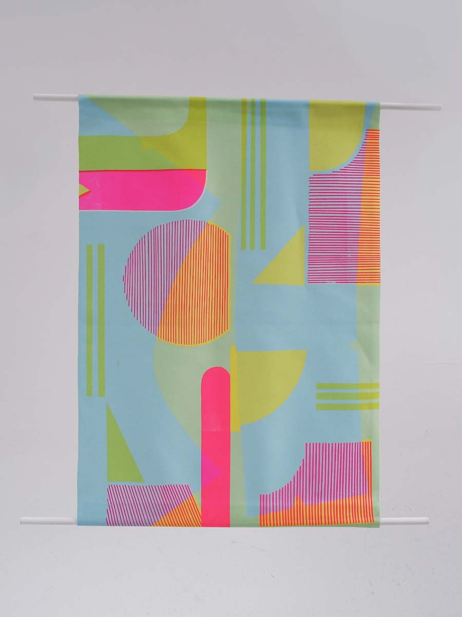 Vibrant textile wall decor featuring geometric shapes.