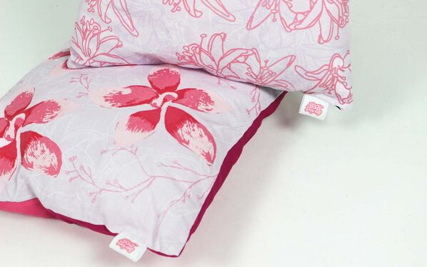 Two pink flower design pillows