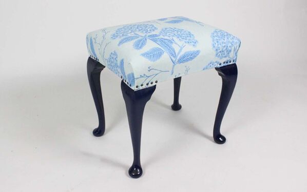 Floral patterned blue and white stool.