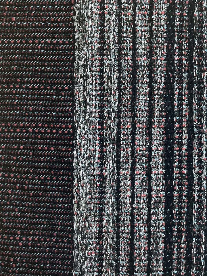 Close up of black and red striped fabric.