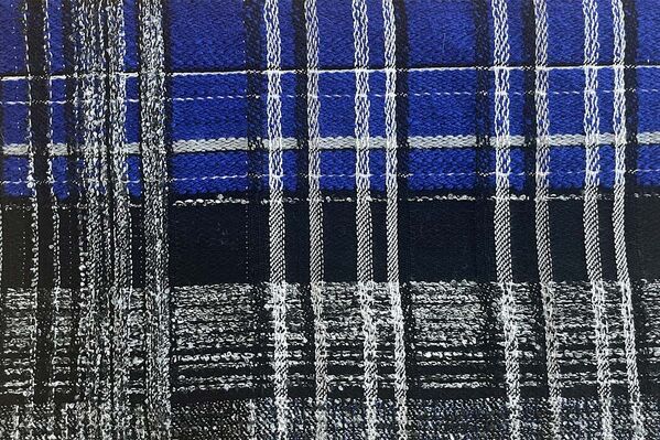A blue and black plaid fabric with a white border.