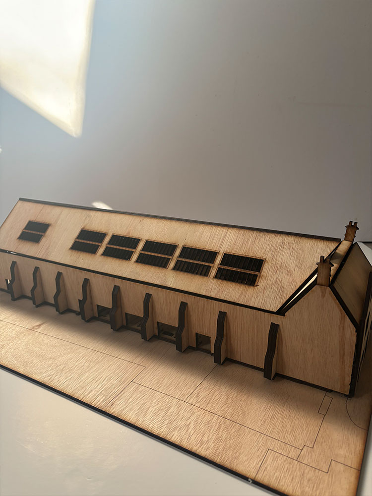 Architectural model of building showcasing the roof and window details.