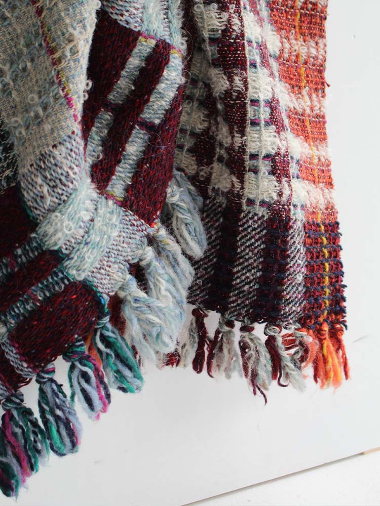 A soft blanket featuring charming tassels.