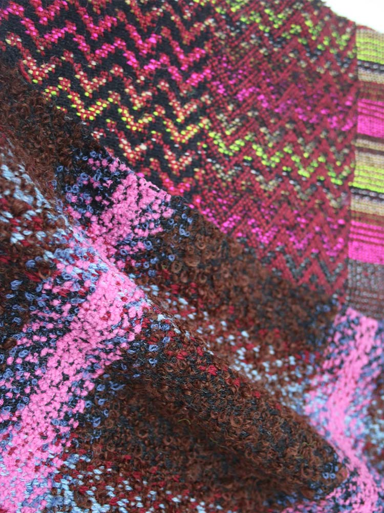 Colorful patterned blanket in close-up view.