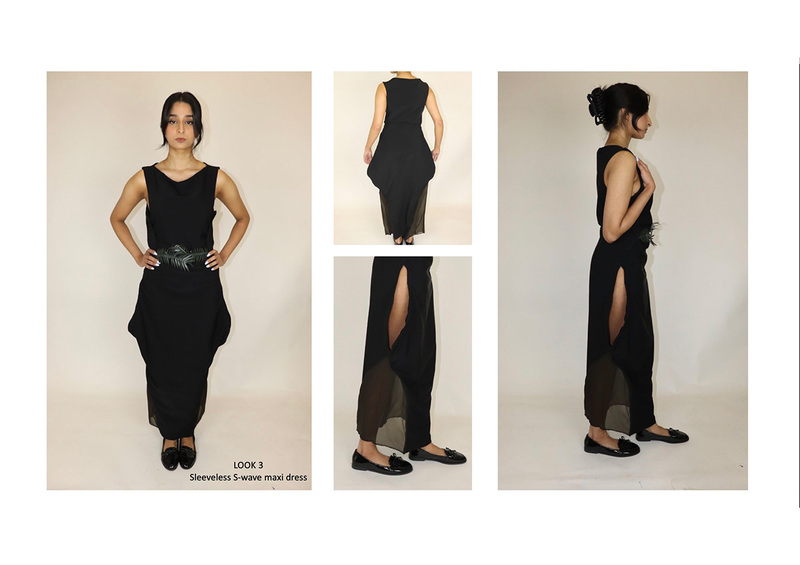 Woman models a full length S-wave black dress with ornate palm tree frond like metal forming a belt at the waist and slit sections on the side of each thigh