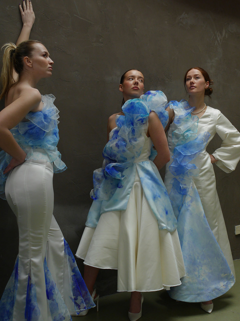 Three women model designs by Nadia Hodgkinson
