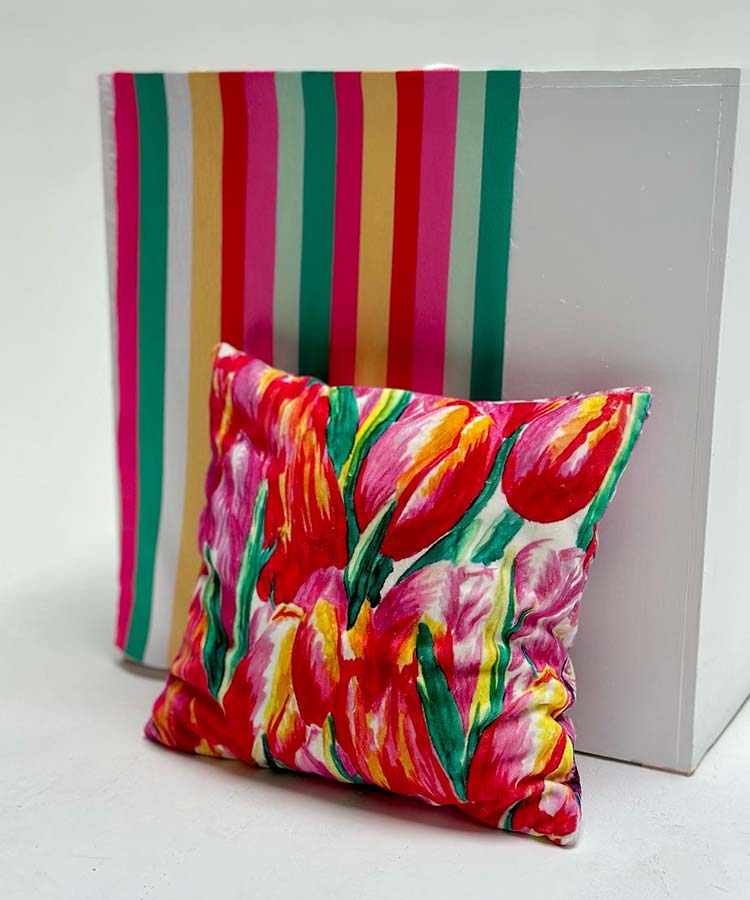 Colorful striped pattern and decorative tulip pattern pillow.