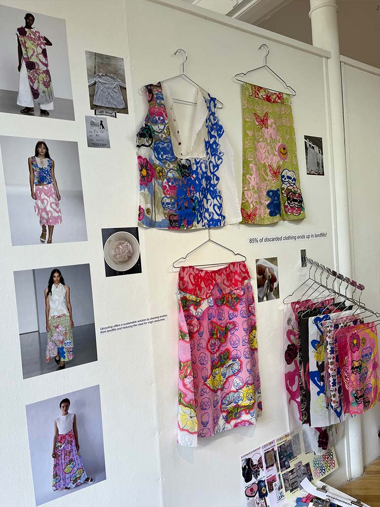 Wall-mounted display featuring a variety of stylish clothing and accessories.