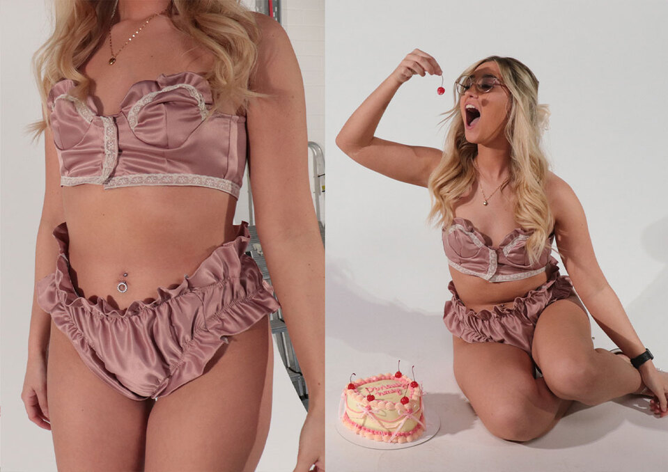 Two images of a woman in a satin underwear posing with a cake whilst eating a cherry..