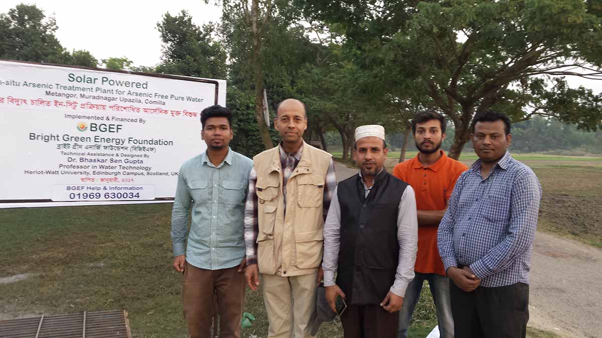 The Nature-based Solutions group stand outside a solar powered arsenic treatment plant